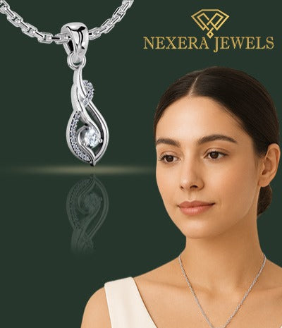 Woman wearing a silver necklace with a Nexera Jewels pendant against a dark green background